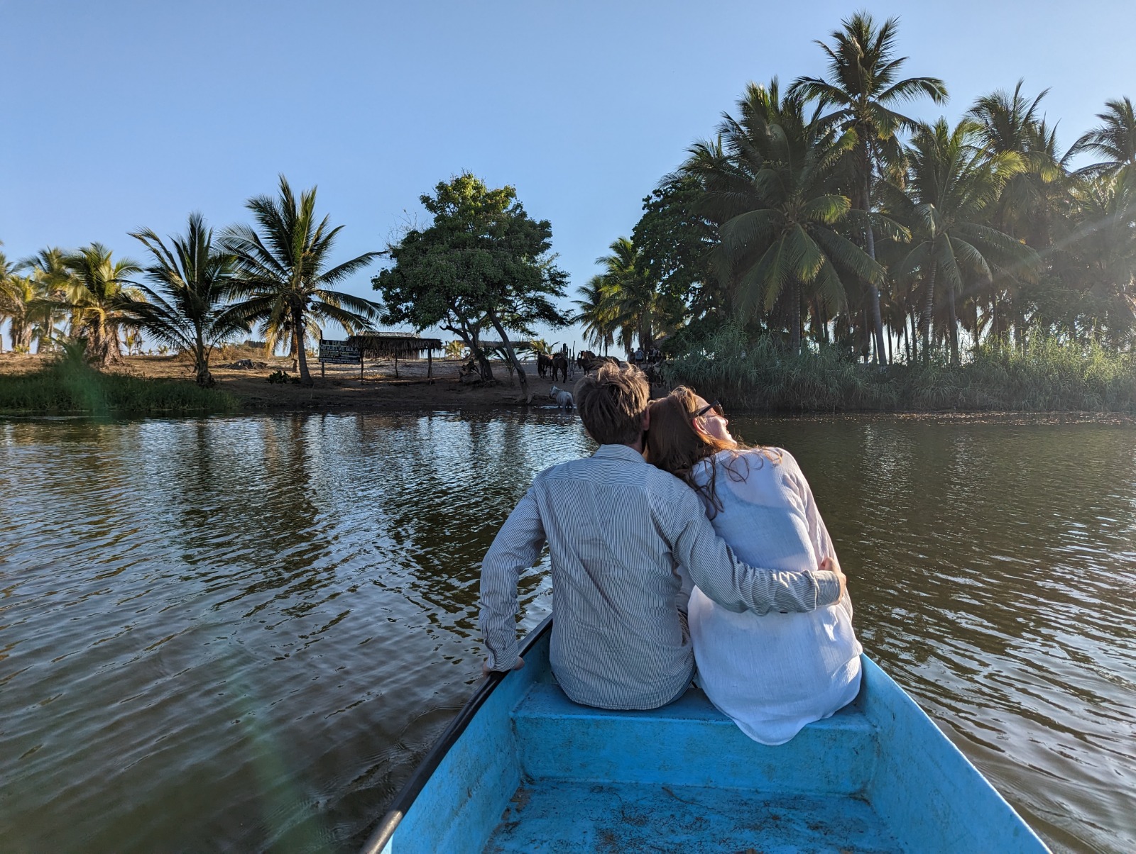 Romantic couple enjoying boat ride across the lagoon
